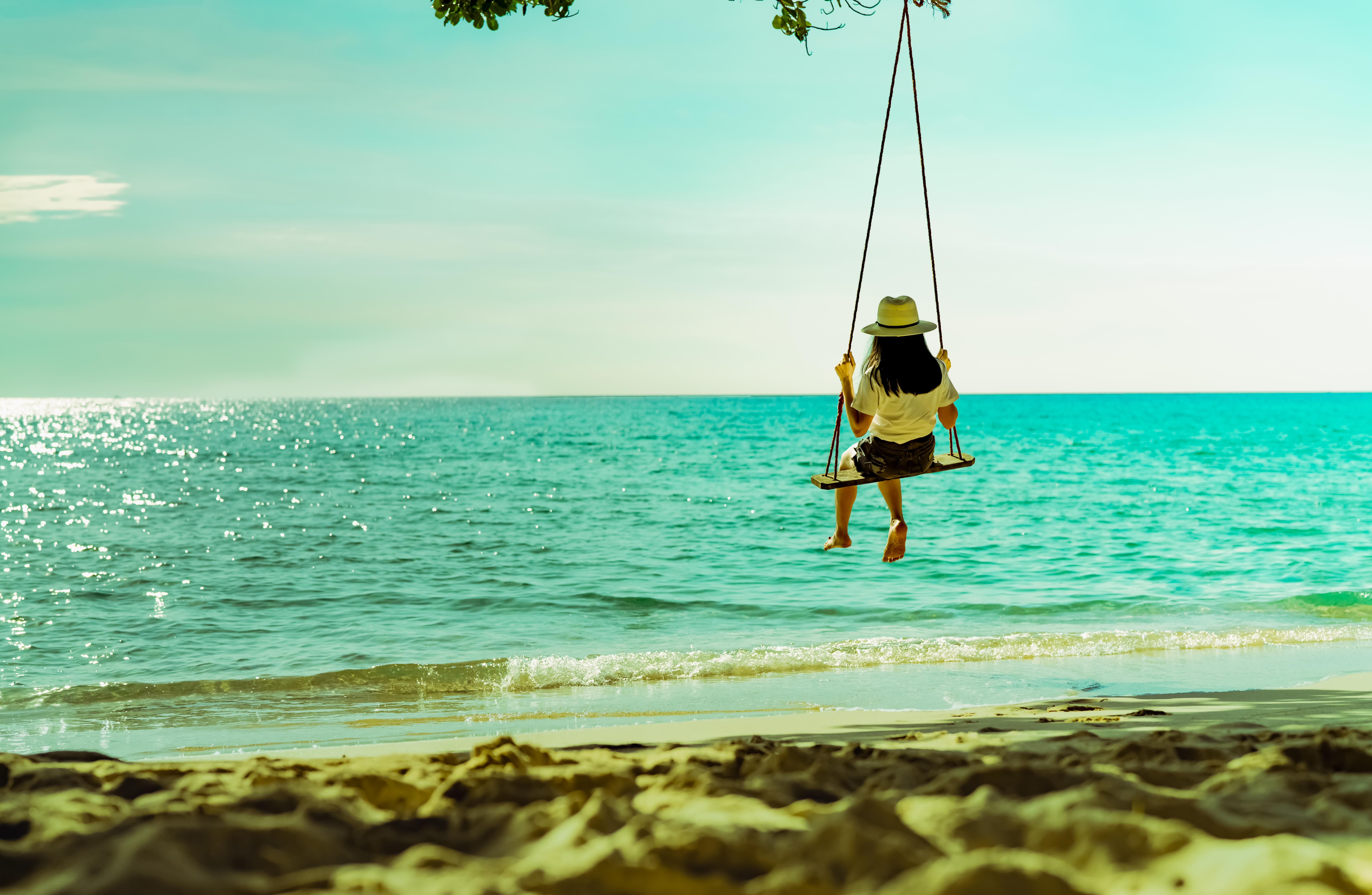what we do - sustainable ecotourism a girl on a swing - banner image for what we do to care med - sustainable ecotourism