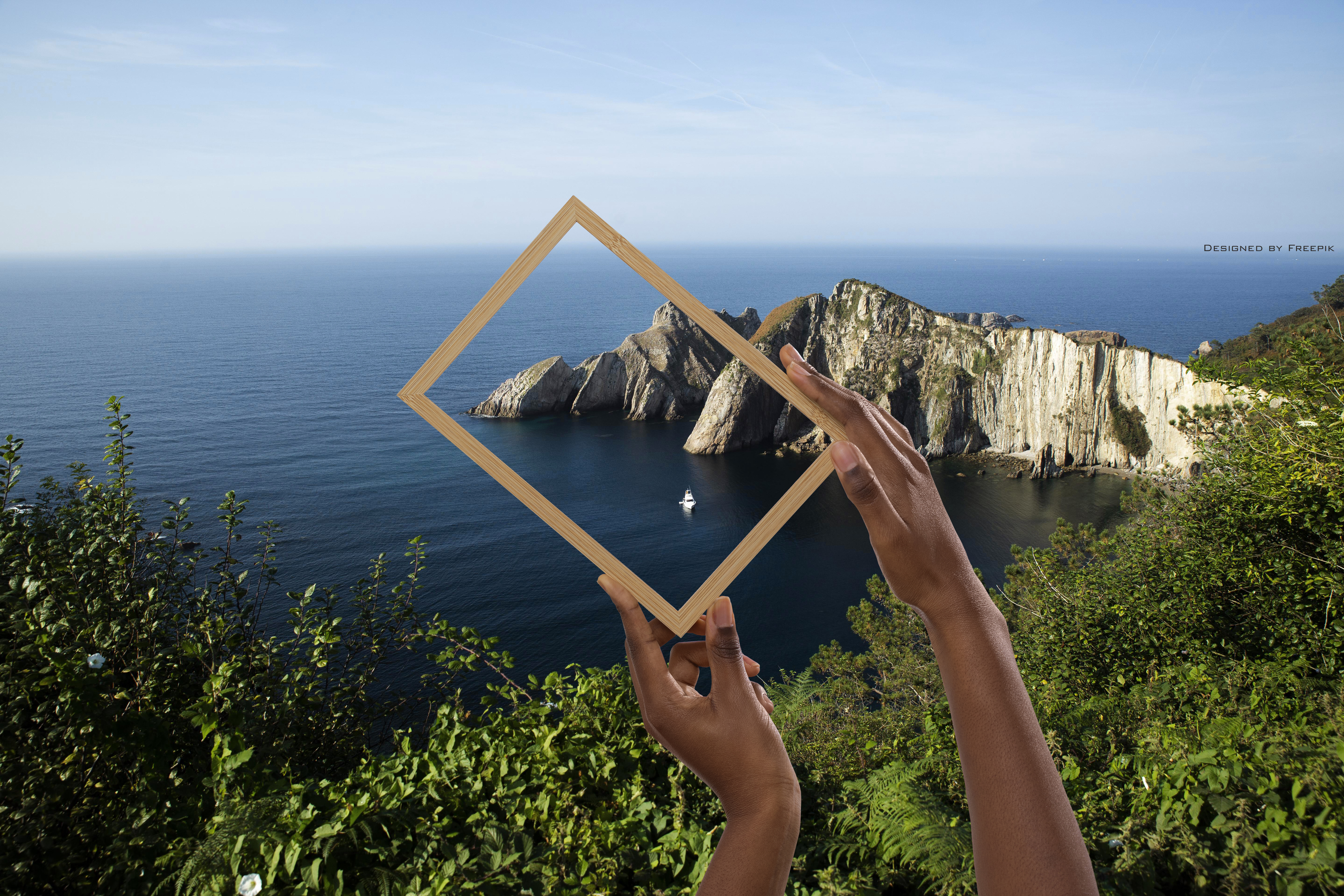 TO CARE MED Primary photo Hand holding the picture frame where you can see the extract of the see and a cliff