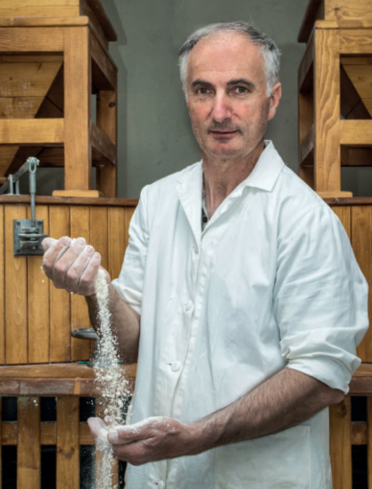 Tifernum a man holding flower in hand